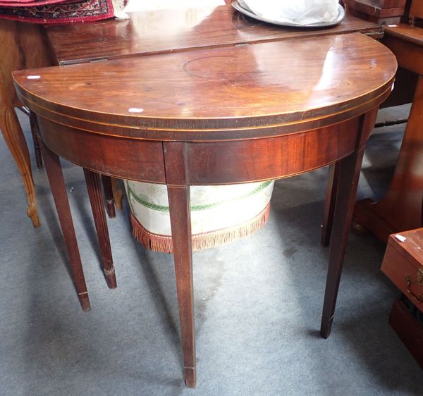 A GEORGE III MAHOGANY DEMI-LUNE TEA TABLE