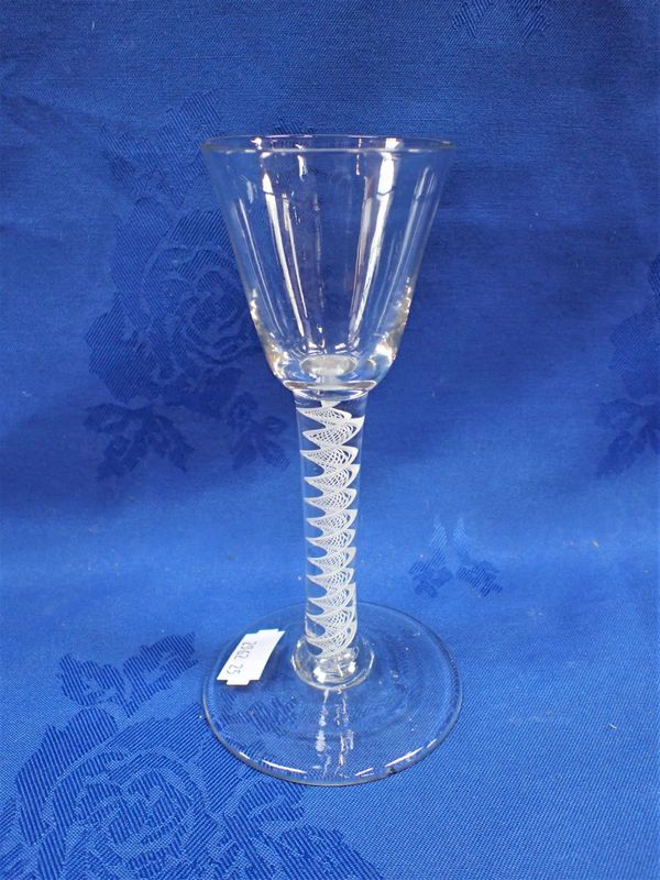 AN AIR-TWIST GLASS WITH A BROAD FOLD-OVER FOOT