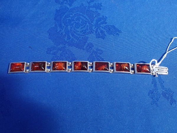 A SILVER AND AMBER BRACELET