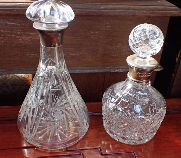 TWO CUT GLASS DECANTERS WITH SILVER COLLARS