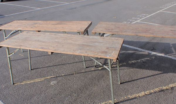 THREE FOLDING TRESTLE TABLES WITH PINE BOARDED TOPS