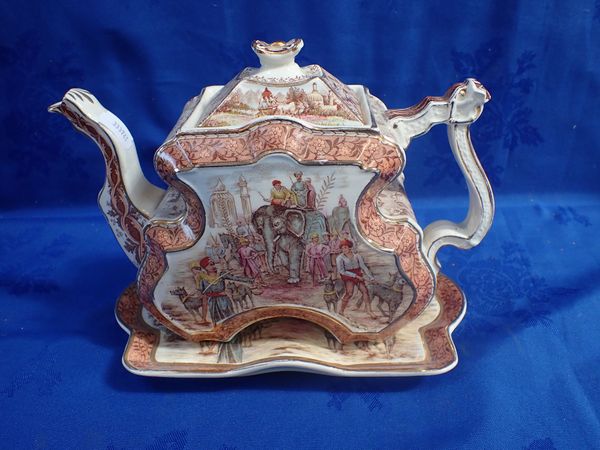 A BURGESS & LEIGH INDIAN EMPIRE SCENE TEAPOT WITH STAND