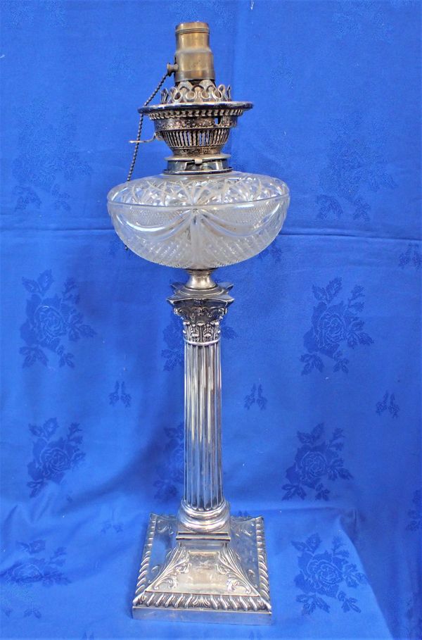 A VICTORIAN SILVER-PLATED CORINTHIAN COLUMN OIL LAMP