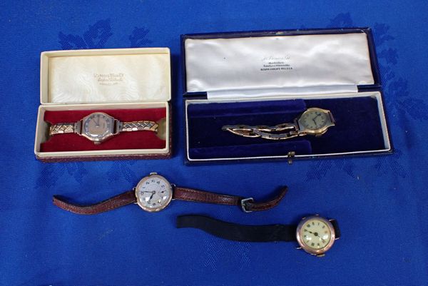 FOUR GOLD CASED WATCHES