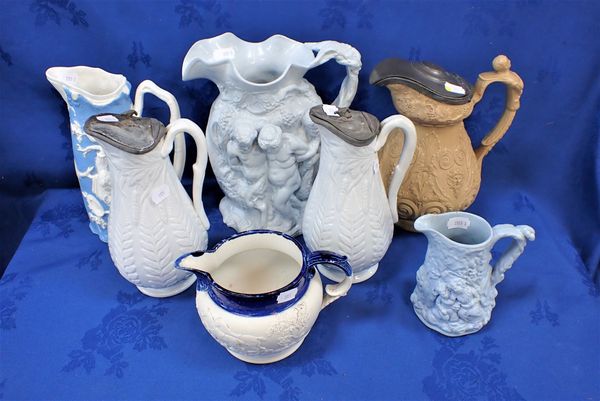 A COLLECTION OF 19TH CENTURY RELIEF-MOULDED JUGS
