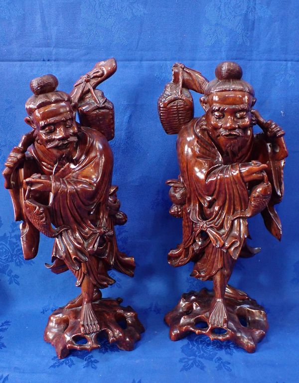 A PAIR OF CHINESE CARVED HARDWOOD FIGURES