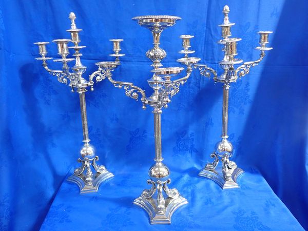 A PAIR OF IMPRESSIVE VICTORIAN SILVER-PLATED CANDELABRA AND MATCHING CENTREPIECE