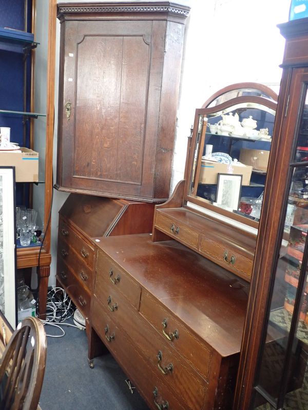 A GEORGE III OAK HANGING CORNER CUPBOARD