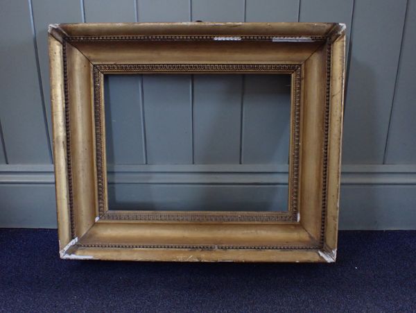 A 19TH CENTURY GILT PICTURE FRAME