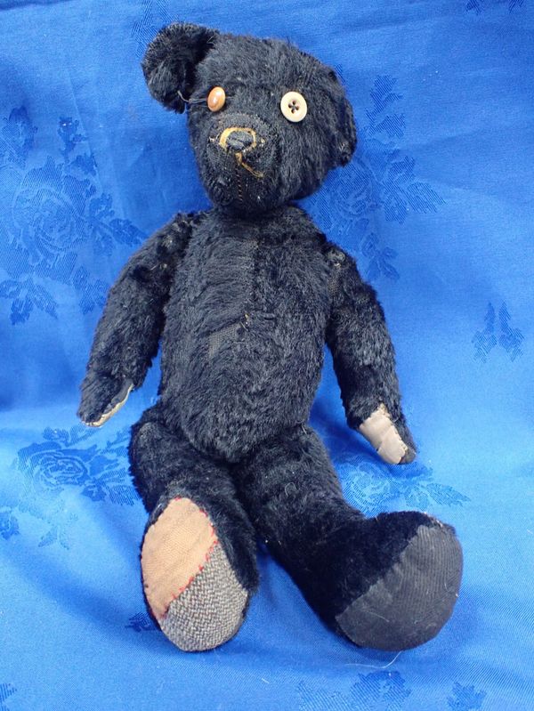 A BLACK TEDDY BEAR, POSSIBLY STEIFF,  EARLY 20TH CENTURY