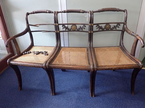 A THREE-SEAT SETTEE, MADE FROM THREE REGENCY FAUX-ROSEWOOD CHAIRS
