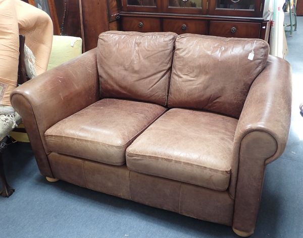 A LEATHER UPHOLSTERED TWO-SEATER SOFA