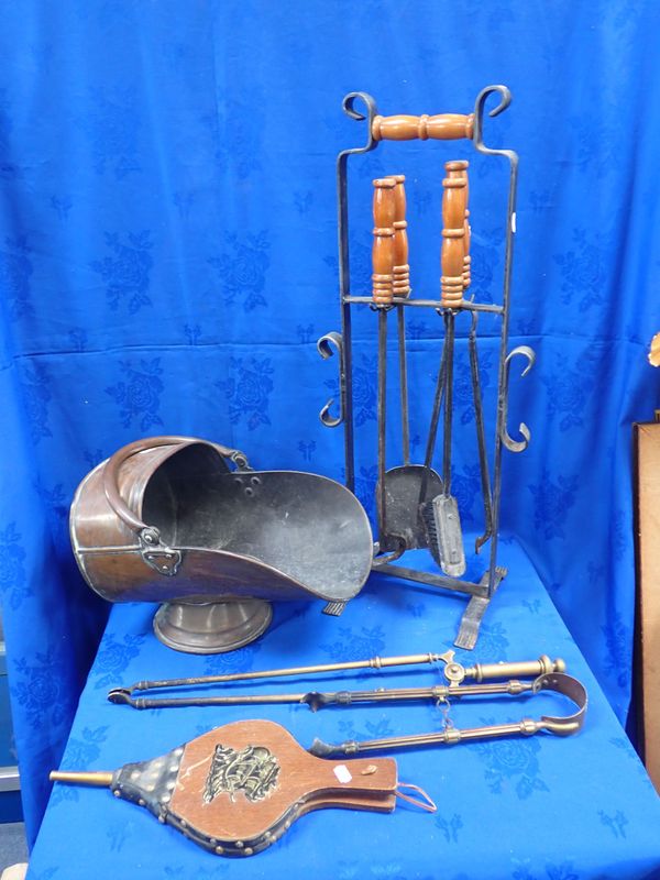 A BRASS COAL SCUTTLE WITH A SET OF FIRE IRONS