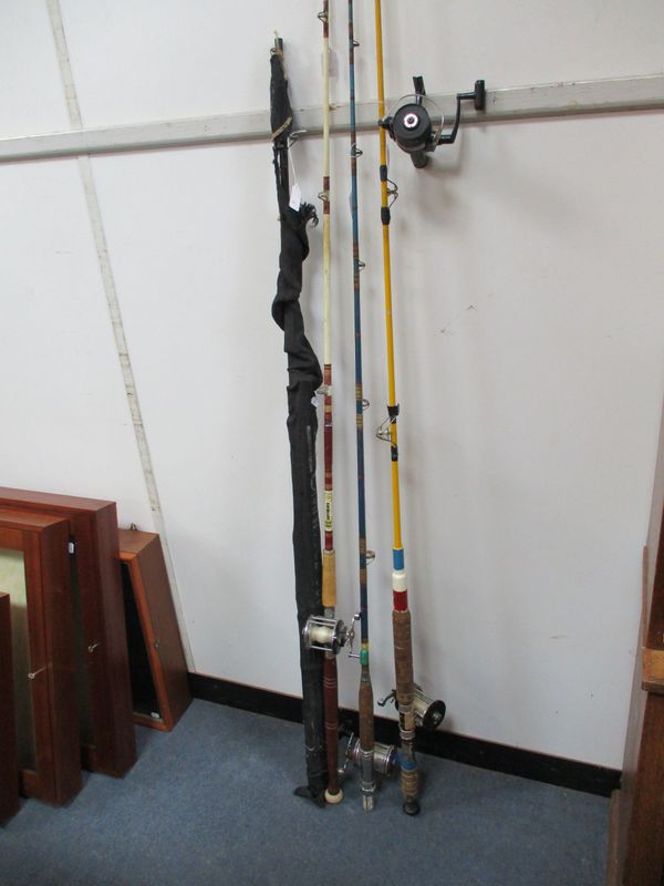 FOUR FISHING RODS AND REELS
