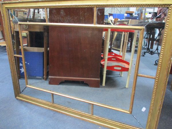 A REGENCY GILT-FRAMED WALL MIRROR