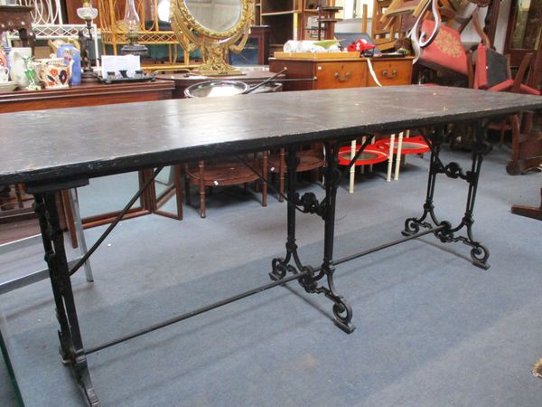 A REFECTORY STYLE TABLE WITH CAST IRON BASE