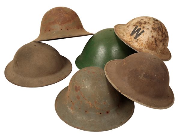 A QUANTITY OF BRITISH AND EUROPEAN MILITARY TIN HELMETS