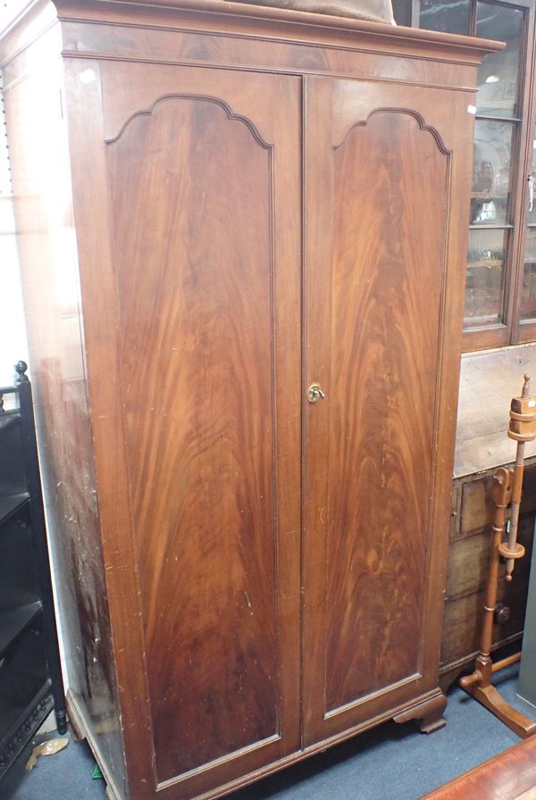 A 1920s MAHOGANY TWO-DOOR WARDROBE