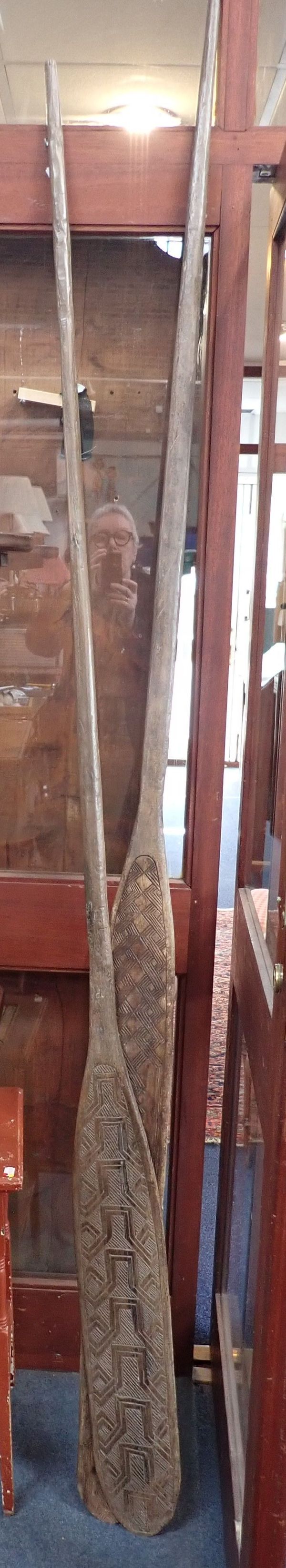 TWO INDONESIAN DECORATIVE WOODEN PADDLES