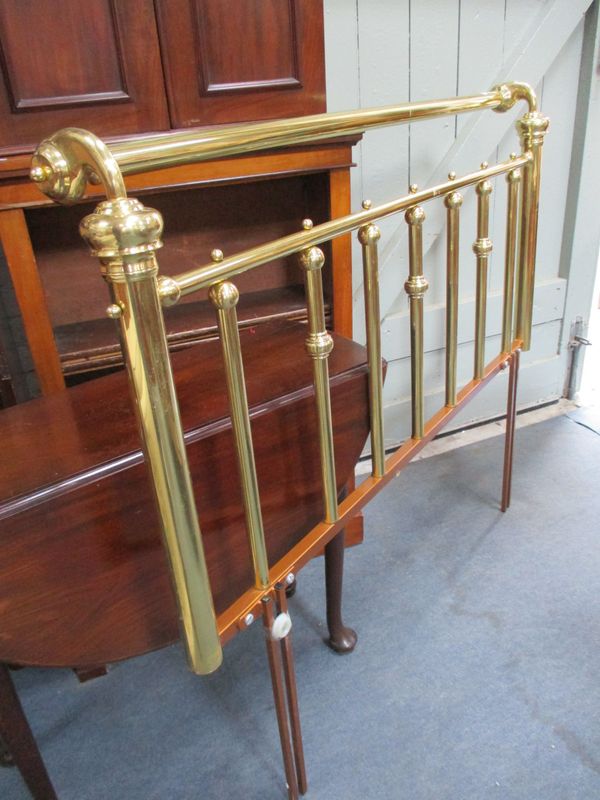 A VICTORIAN STYLE BRASS BEDHEAD, WITH SCROLLING ENDS