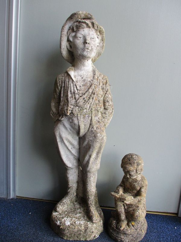 A RECONSTITUTED STONE GARDEN STATUE OF A BOY