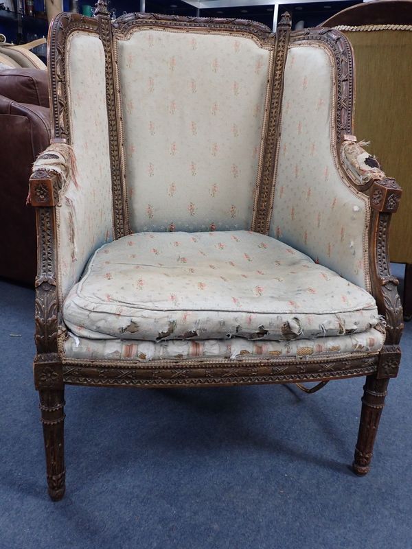 A LOUIS XIV STYLE ARMCHAIR, WITH PROFUSELY CARVED FRAME