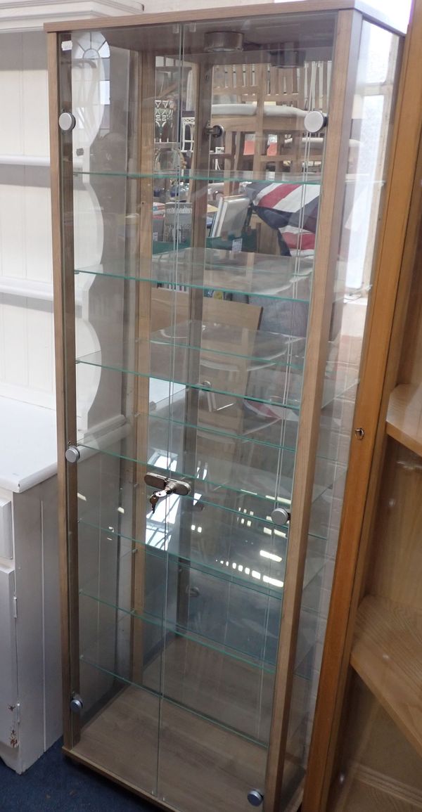A MODERN GLAZED SHOP DISPLAY CABINET WITH SEVEN GLASS SHELVES