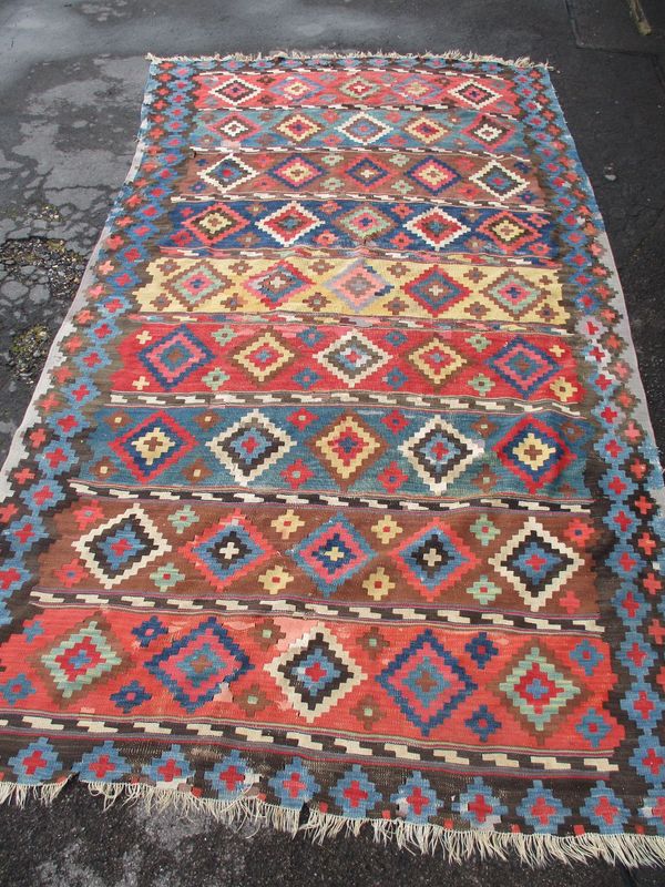 A LARGE KILIM RUG