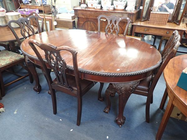 AN EDWARDIAN CHIPPENDALE REVIVAL DINING TABLE AND FOUR CHAIRS