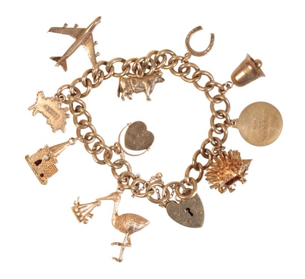 A 9CT GOLD CHARM BRACELET