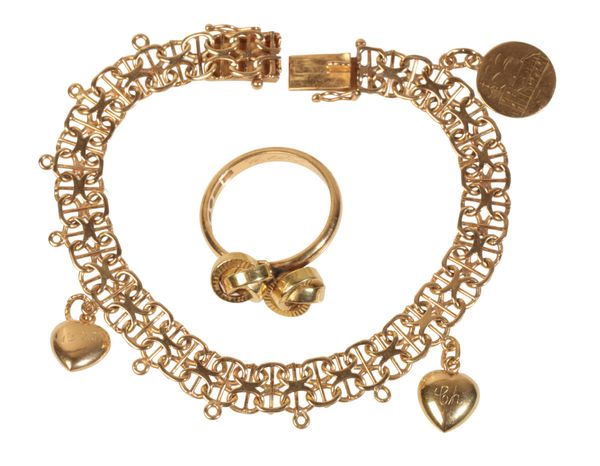 A FANCY LINK GOLD CHARM BRACELET