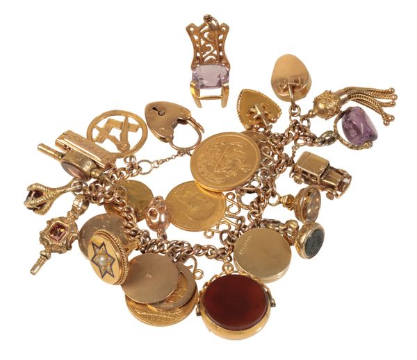 A 9CT GOLD CHARM BRACELET WITH PADLOCK CLASP