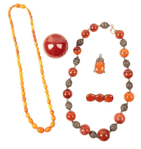 A LARGE CHERRY AMBER BEAD