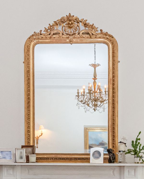 A LARGE GILTWOOD AND COMPOSITION OVERMANTEL MIRROR