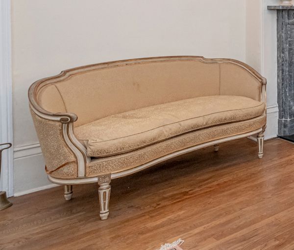 A LOUIS XVI STYLE WHITE-PAINTED AND PARCEL-GILT SOFA