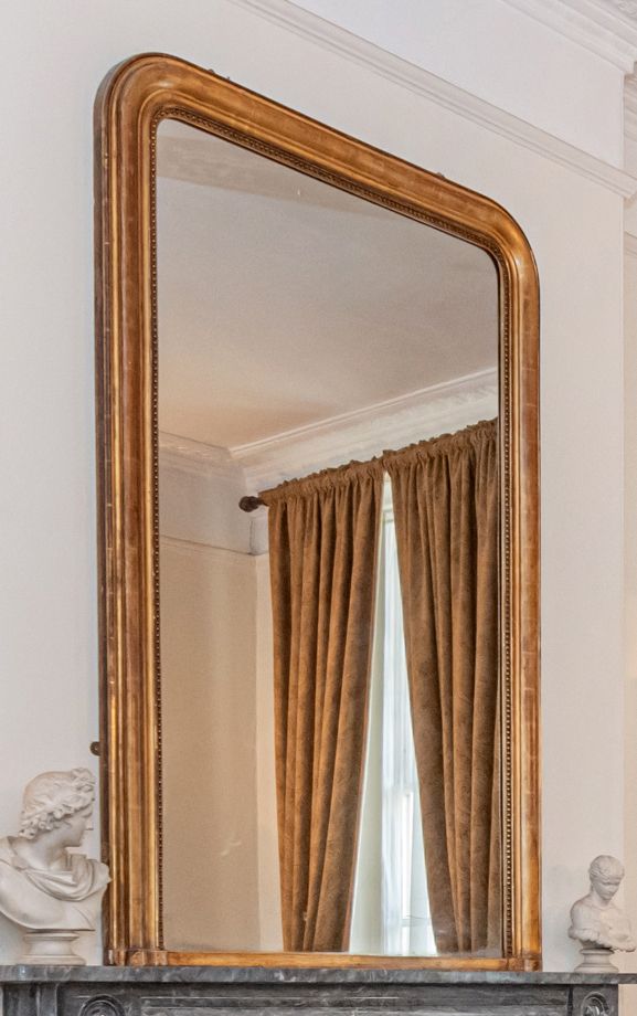 A LARGE GILTWOOD OVERMANTEL MIRROR