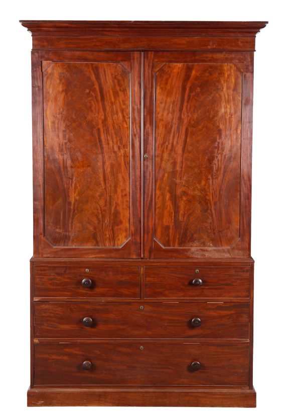 AN EARLY VICTORIAN FIGURED MAHOGANY LINEN PRESS