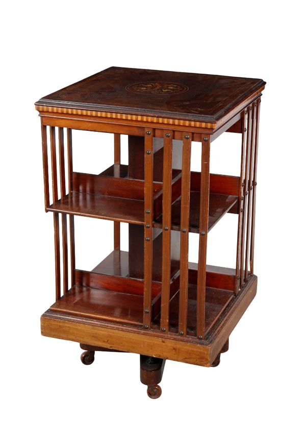 AN EDWARDIAN MAHOGANY AND MARQUETRY REVOLVING BOOKCASE