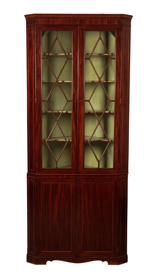 A GEORGE III MAHOGANY CORNER CUPBOARD