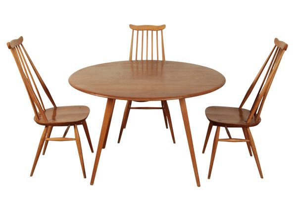 AN ERCOL BLOND ELM OVAL DROP LEAF DINING TABLE