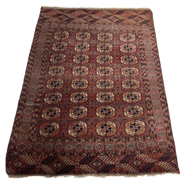 A PERSIAN TEKKE BOKHARA STYLE RUG