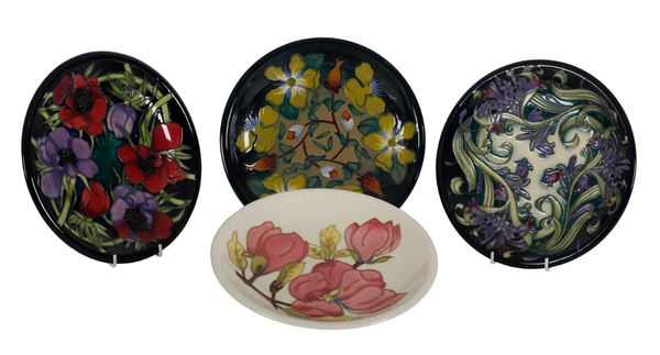 A GROUP OF FOUR MOORCROFT PLATES