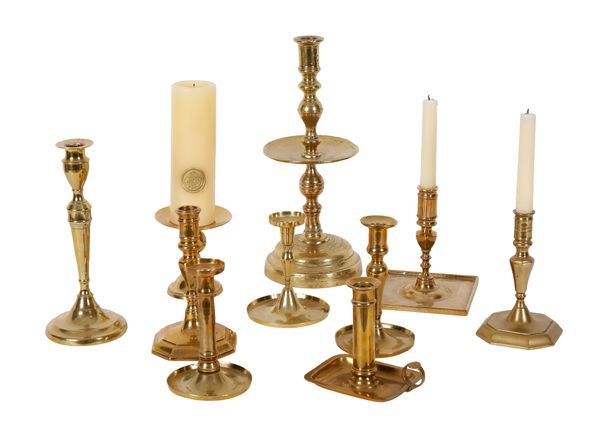 A COLLECTION OF TEN BRASS CANDLESTICKS