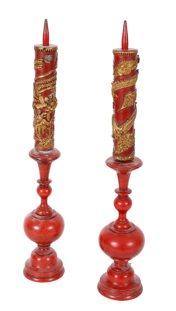 A PAIR OF CHINESE LACQUER AND PARCEL GILT CANDLESTICKS