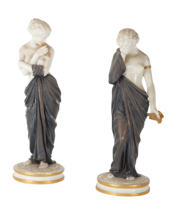A PAIR OF ROYAL WORCESTER PORCELAIN FIGURES DEPICTING JOY AND SORROW