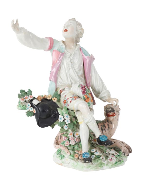 A DERBY TYPE PORCELAIN FIGURE OF A SEATED BOY
