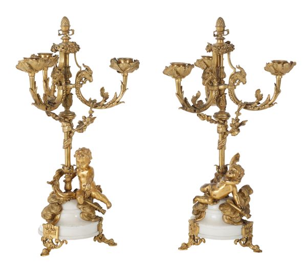 A PAIR OF 19TH FRENCH ORMOLU AND WHITE MARBLE THREE BRANCH CANDELABRA