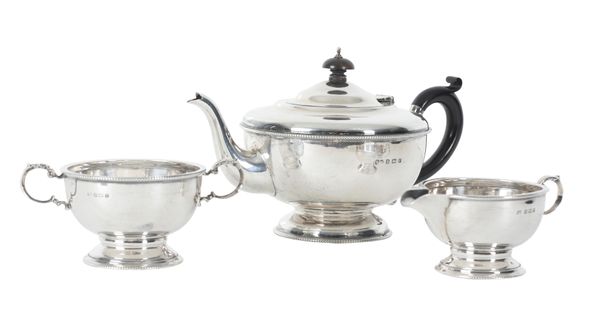 A GEORGE V SILVER THREE PIECE TEA SERVICE