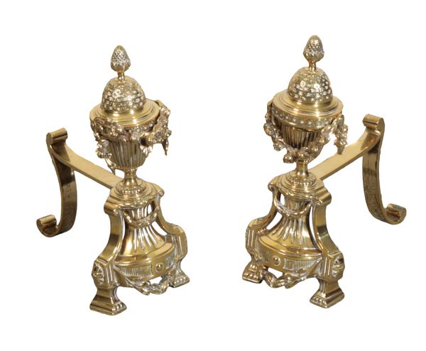 A PAIR OF LATE 19TH CENTURY POLISHED BRASS IMPLEMENT RESTS