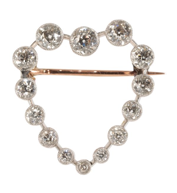 A HEART SHAPED DIAMOND BROOCH